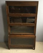 A four tier angus oak barristers stacking bookcase