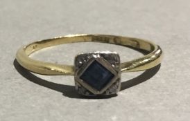 An 18 ct gold Deco diamond and sapphire ring