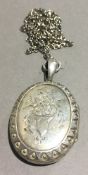 A Victorian silver locket pendant and chain