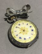 A Continental silver cased lady's/nurses fob watch together with a silver bow brooch (26 grammes