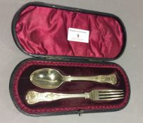 A cased silver spoon and fork