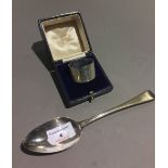 A Georgian silver spoon and a silver napkin ring