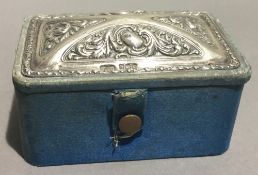 A silver and velvet box