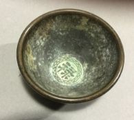 A small Chinese bronze bowl