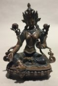 A Tibetan bronze model of Buddha