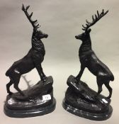 A pair of bronze stags