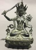 An Eastern bronze model of a deity