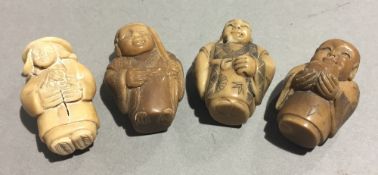 Four carved nut netsukes