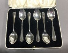 A cased set of silver spoons,