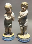 A pair of bisque porcelain figures