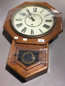 An oak cased drop dial wall clock