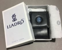 A boxed Lladro purse