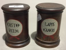 Two turned treen drug jars and covers,