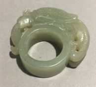 A Chinese carved jade ring