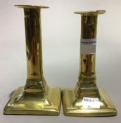 A pair of 19th century brass candlesticks