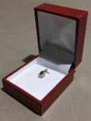 A 9 ct gold ruby and diamond pendant