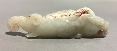 A Chinese carved jade fish