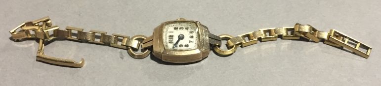 A 9 ct gold cased lady's wristwatch with plated strap