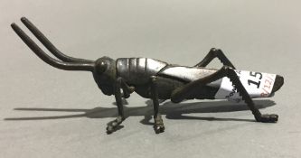 A bronze model of a locust
