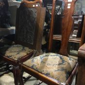 A pair of Queen Anne style chairs and a fire guard