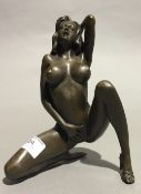 An erotic bronze figure of a crouching nude