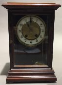 A Victorian walnut cased mantle clock