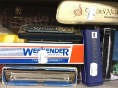 A collection of various harmonicas,