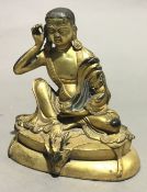 A gilt bronze model of Buddha