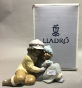 A boxed Lladro matt figural group,