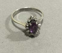 An 18 ct white gold marquise cut tourmaline and diamond set ring