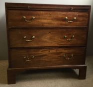A George III mahogany caddy top chest of drawers, with a brushing slide,