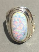 A silver and opal ring