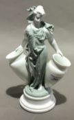 A 19th century porcelain figural bud vase