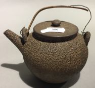 A Japanese brown glazed teapot