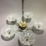 An Art Deco hanging light with moulded glass shades