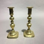 A pair of brass candlesticks