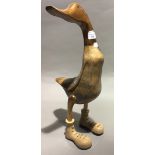 A large duck in boots