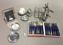 A quantity of small silver items, including a toast rack, a picture frame, etc.