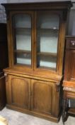 A Victorian mahogany bookcase cabinet