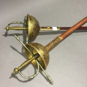 Two wall hanging swords