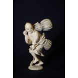 Mid 19th C Japanese carved ivory figure of a fisherman with insert cinnabar lacquer signature panel