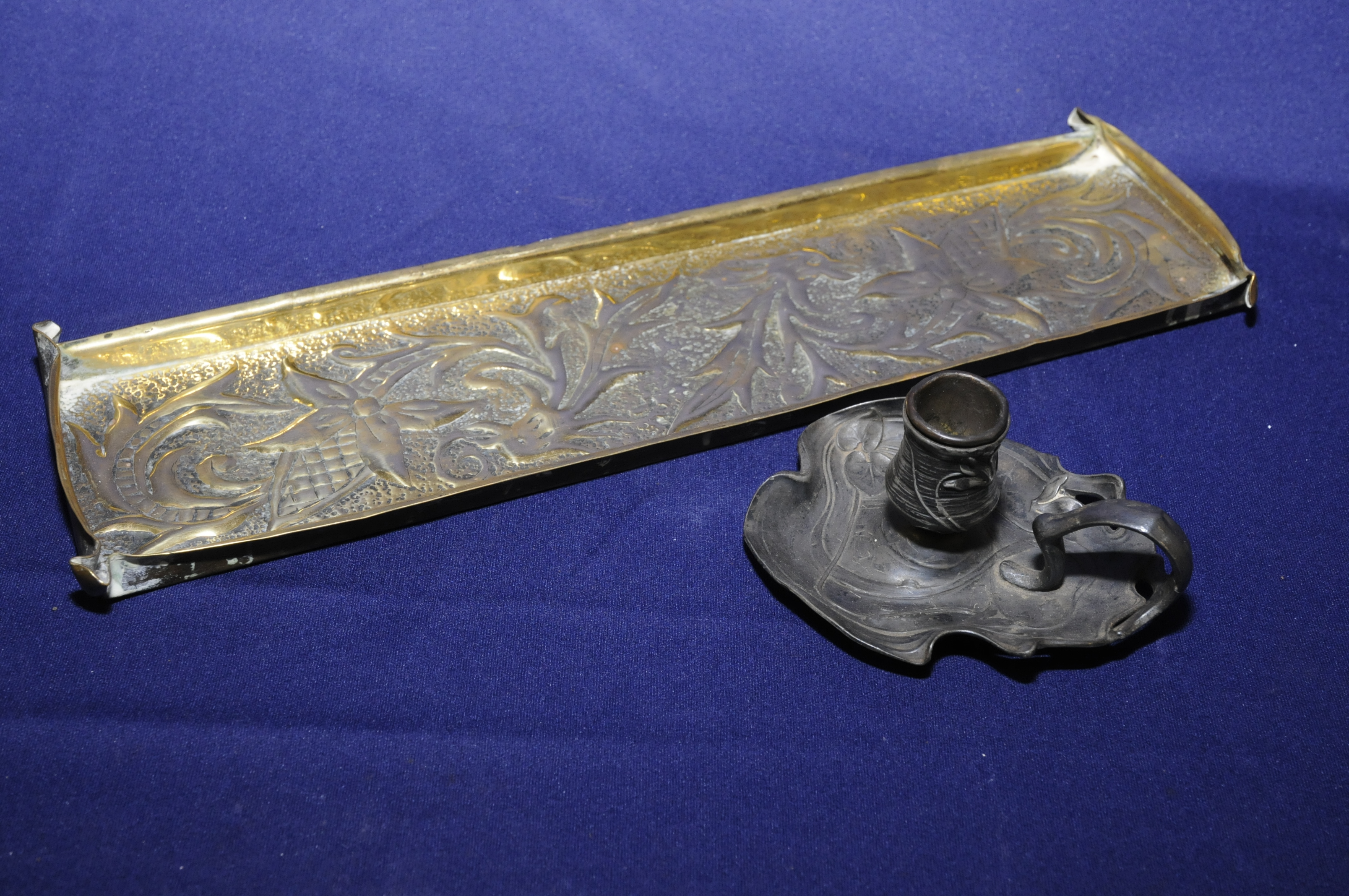 Art Nouveau chamber stick with looped handle and embossed design stamped to underside WMF (height