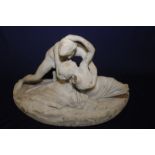 Late 19th C carved marble group of a couple depicting reclining semi-clad female and naked male in