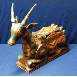 Carved wood and painted Indian style temple figure of a deer with slide off top compartment (38cm