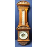 Late Victorian elaborately carved mahogany wall barometer with enamel dial marked John Davies Ltd