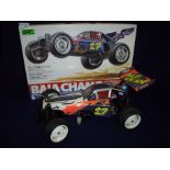 Boxed Baja Champ 1/10th scale radio controlled four wheel drive high performance off road racing
