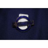 London Transport blue enamel advertising cap badge by J.