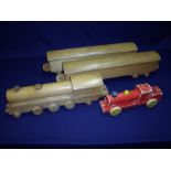 Vintage wooden railway locomotive and two carriages and another red painted wooden train