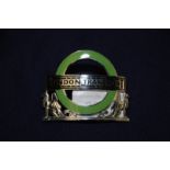 London Transport green enamel cap badge by J.