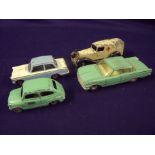 Four Vintage Dinky cars including Triumph Herald,